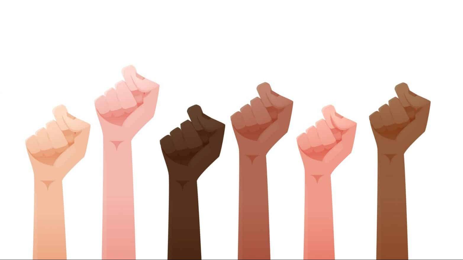 illustration of fists of people of different skin colors raised together in the air.