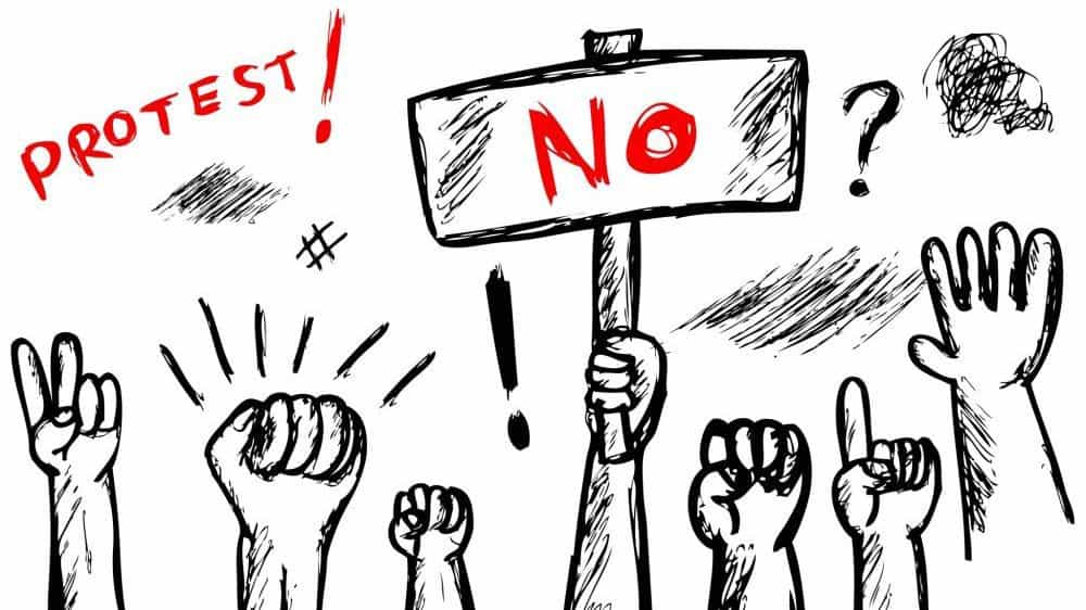 Black and white drawing of hands raised up in different protest gestures. One holds a sign that says "no" in bold red letters.