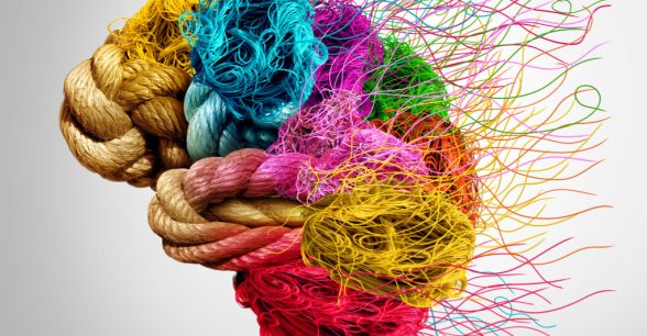 An image of a brain made up of different colored ropes. At the back, the ropes are fraying.