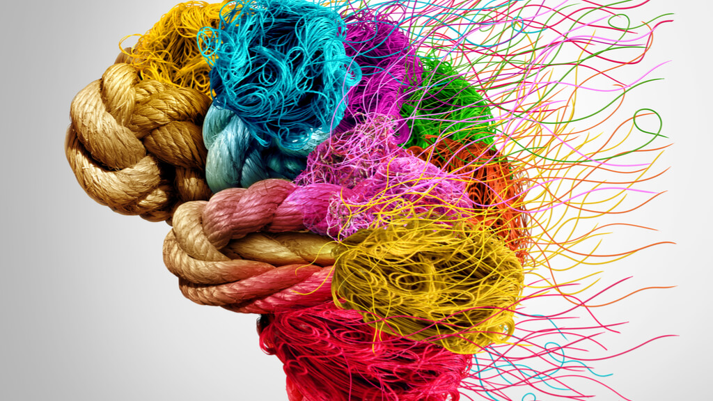 An image of a brain made up of different colored ropes. At the back, the ropes are fraying.