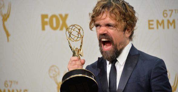 Photo of Peter Dinklage holding an Emmy
