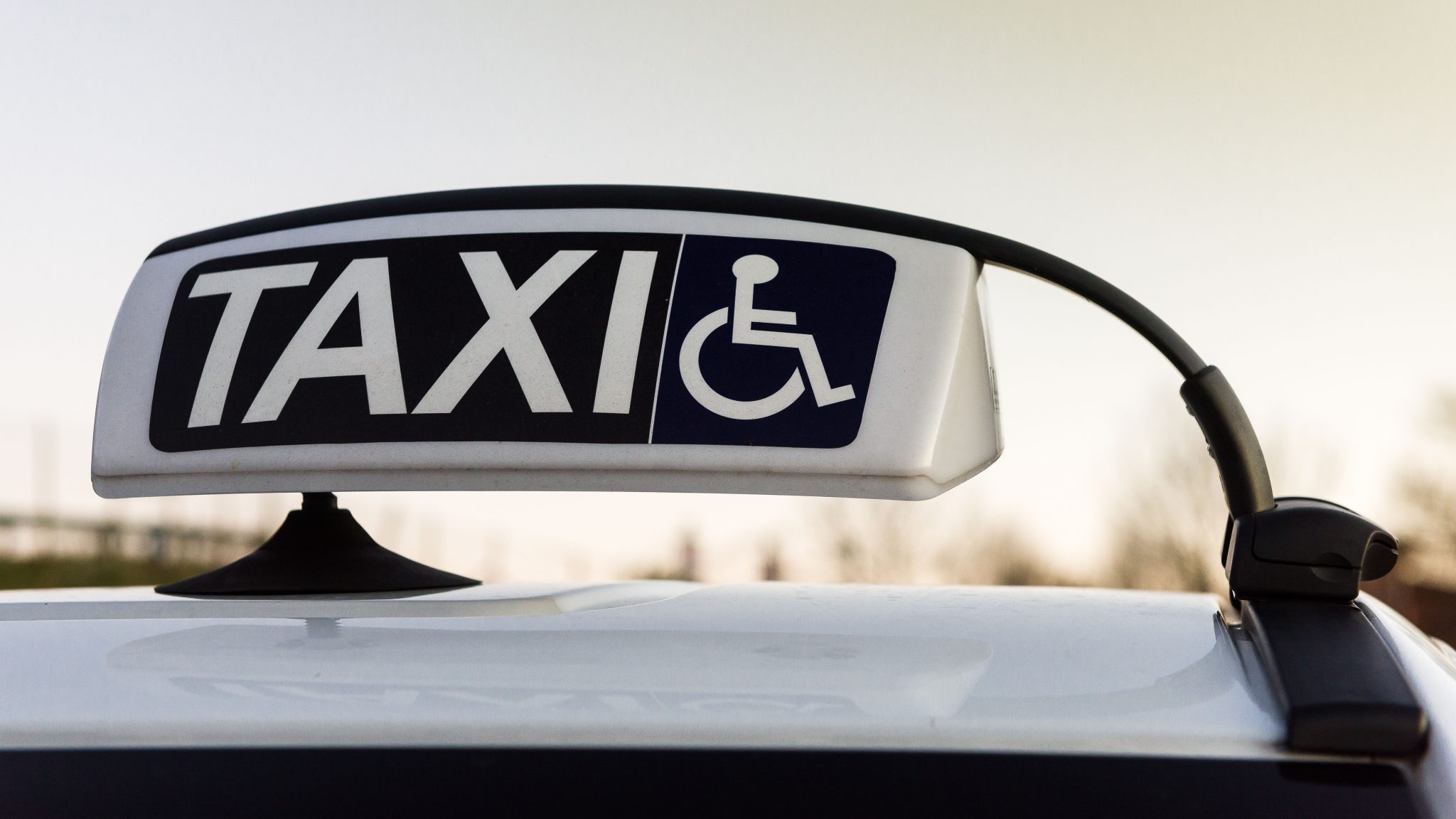 Taxi signage with wheelchair symbol