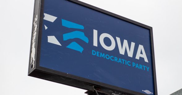 A big blue sign that says "Iowa Democratic Party"
