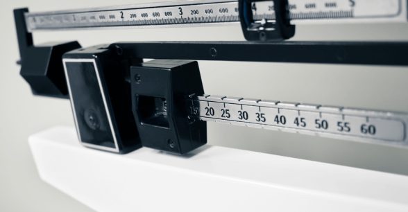 The top of a traditional doctor's office standing weight scale