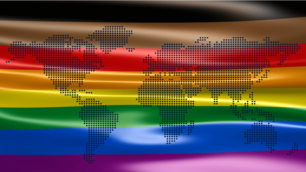 A BIPOC-inclusive pride flag with a map of the world on top of it.