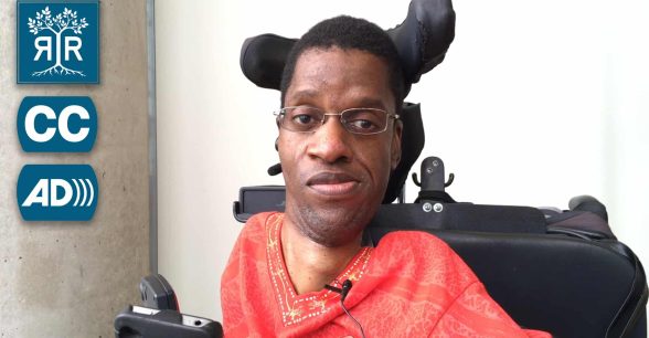 Paul Tshuma is sitting in his wheelchair facing the camera.