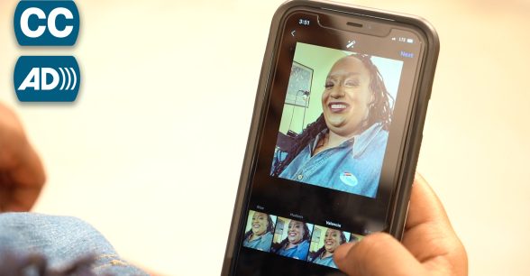 A cell phone showing a picture of a young Black woman, Imani Barbarin, smiling.